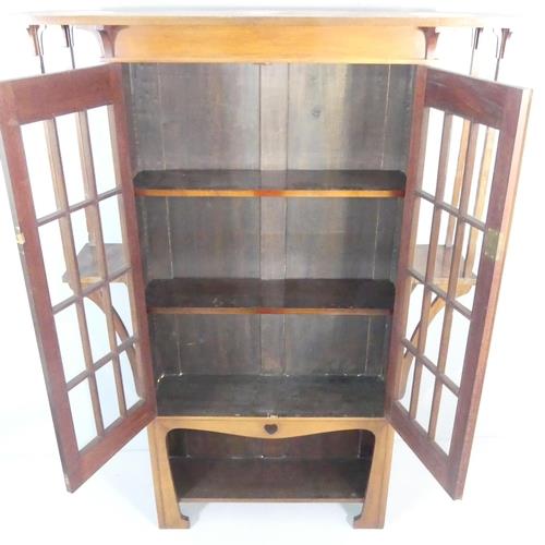An Arts & Crafts / Art Nouveau display bookcase cabinet in the manner of Liberty & Co. 140x194x36cm. - Image 2 of 2