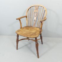 An elm-seated Windsor kitchen chair, with crinoline stretcher.