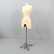A vintage shop-display mannequin on metal stand, labelled All Saints, Spittlefields. Height