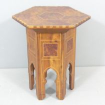 An antique Islamic Amboyna and satinwood strung hexagonal occasional table, with inlaid