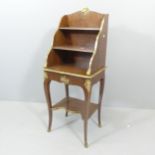 A French 18th century style mahogany directory étagère, with raised shelved back, single drawer
