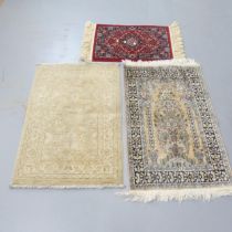 A handmade Afghan wool Ziegler rug, and two other mats. Largest 94x60cm. (3)