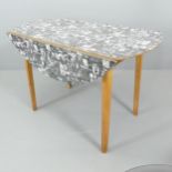 JACQUELINE GROAG - a mid-century Manhattan pattern Warerite formica topped drop leaf dining table,
