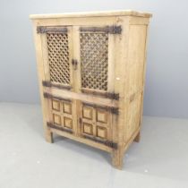 A modern oak cabinet, with two lattice panelled doors and cupboards under. 97x132x54cm. Various