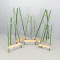 Five various painted wooden folding easels. Tallest 121cm.