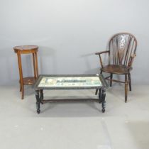 An Indian black-lacquered rectangular coffee table with hand painted decoration and folding base,