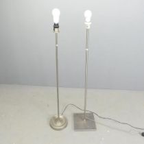 Two modern brushed steel standard lamps. Tallest overall 133cm.