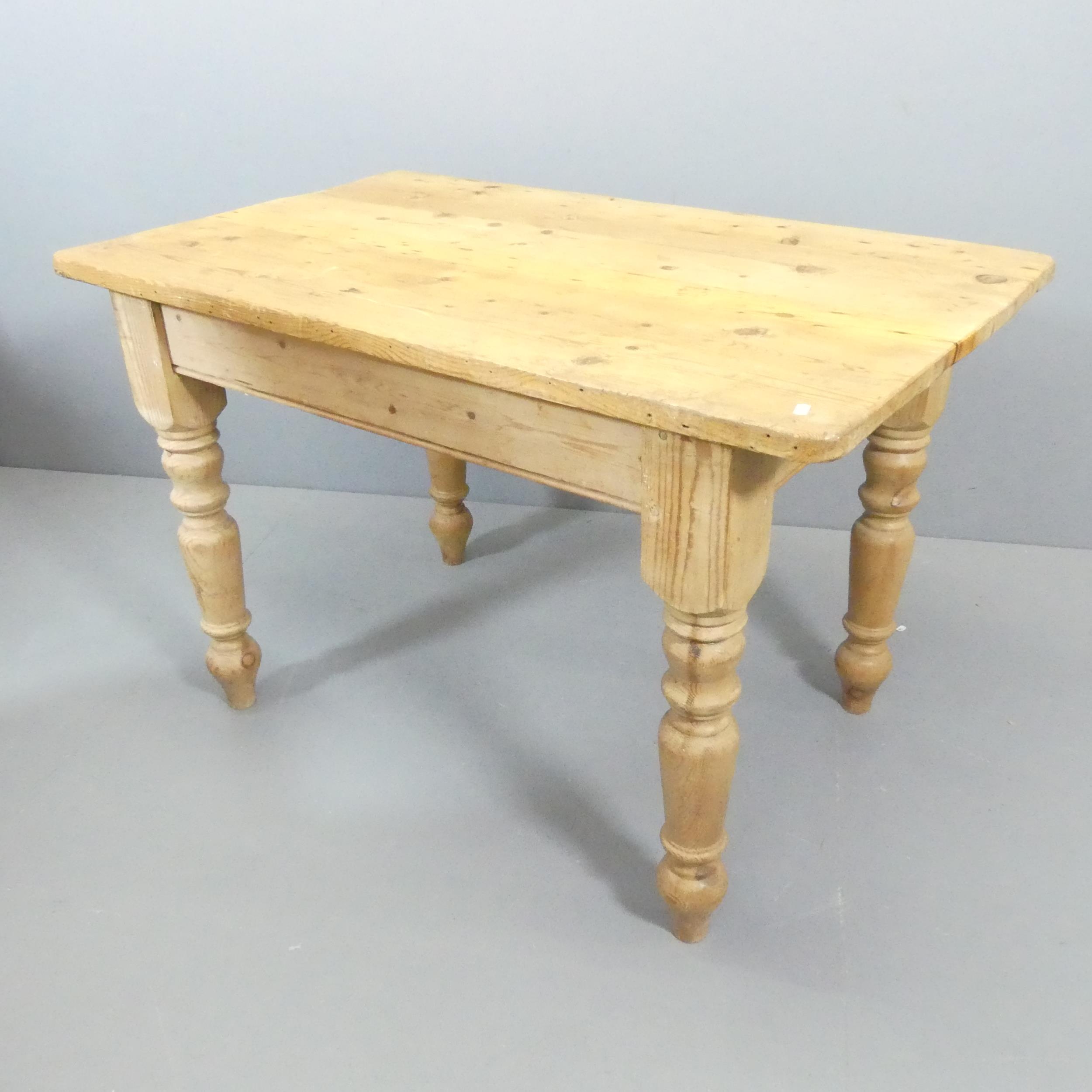 A pine farmhouse kitchen table. 120x77x74cm.