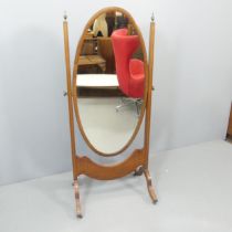 A 19th century mahogany and ebony-strung cheval mirror. 69x150x50cm.