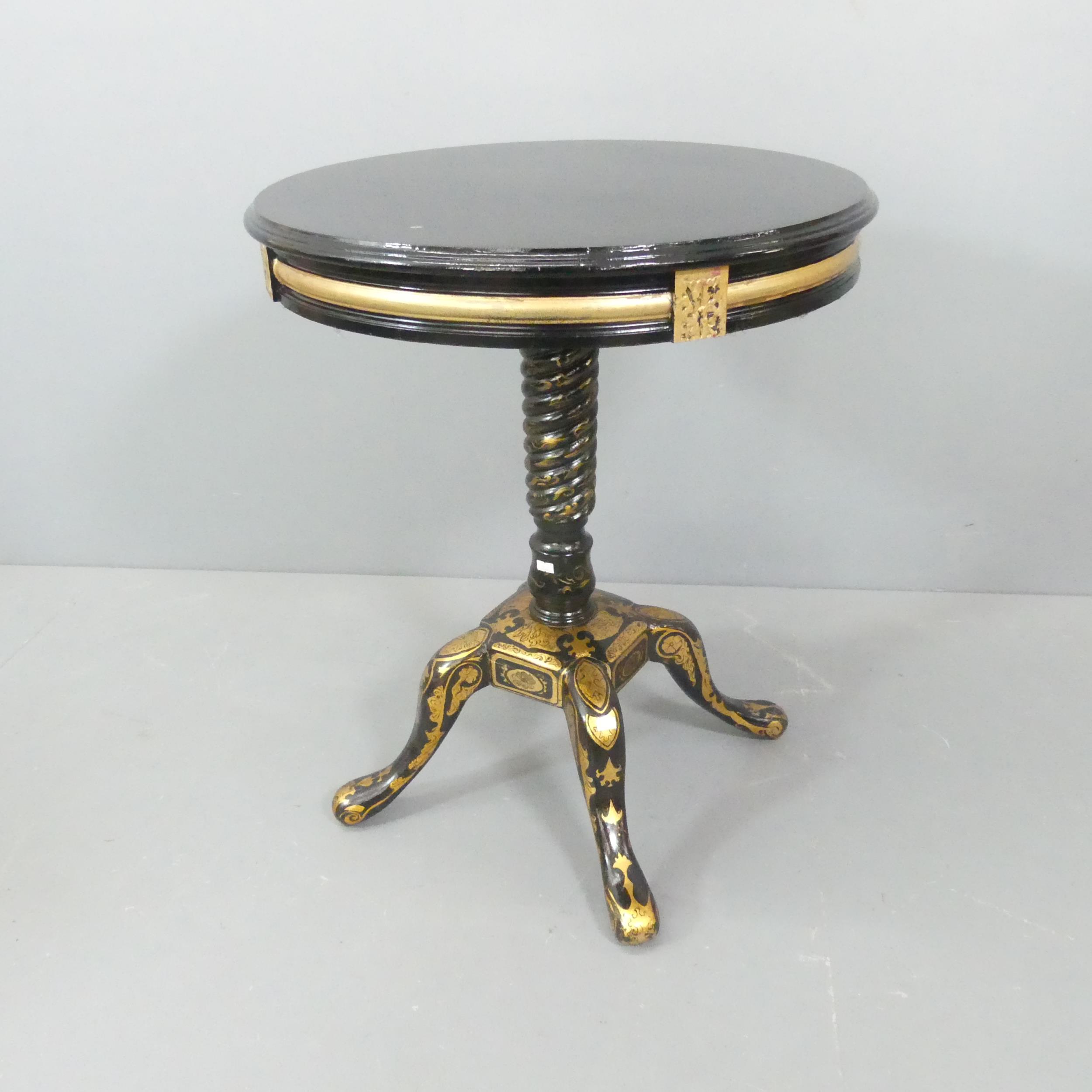 A Continental style ebonised and gilt-painted circular occasional table, with carved and painted