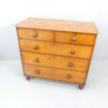 A 19th century mahogany chest of two short and three long drawers, and raised on turned legs.