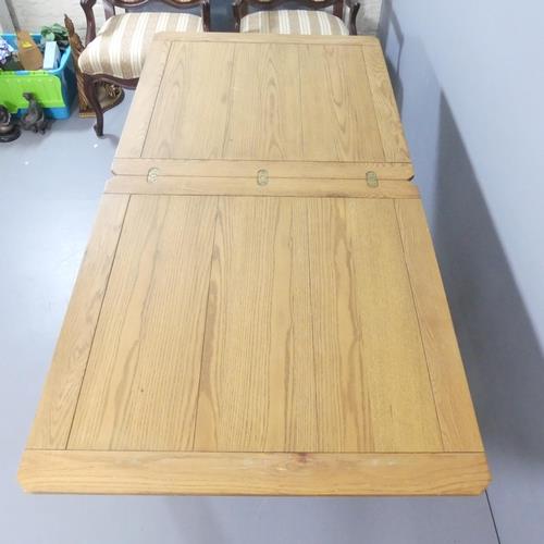 A modern light oak fold-over extending dining table. 90x90x79cm (opening to 180.5cm) Good used - Image 2 of 2