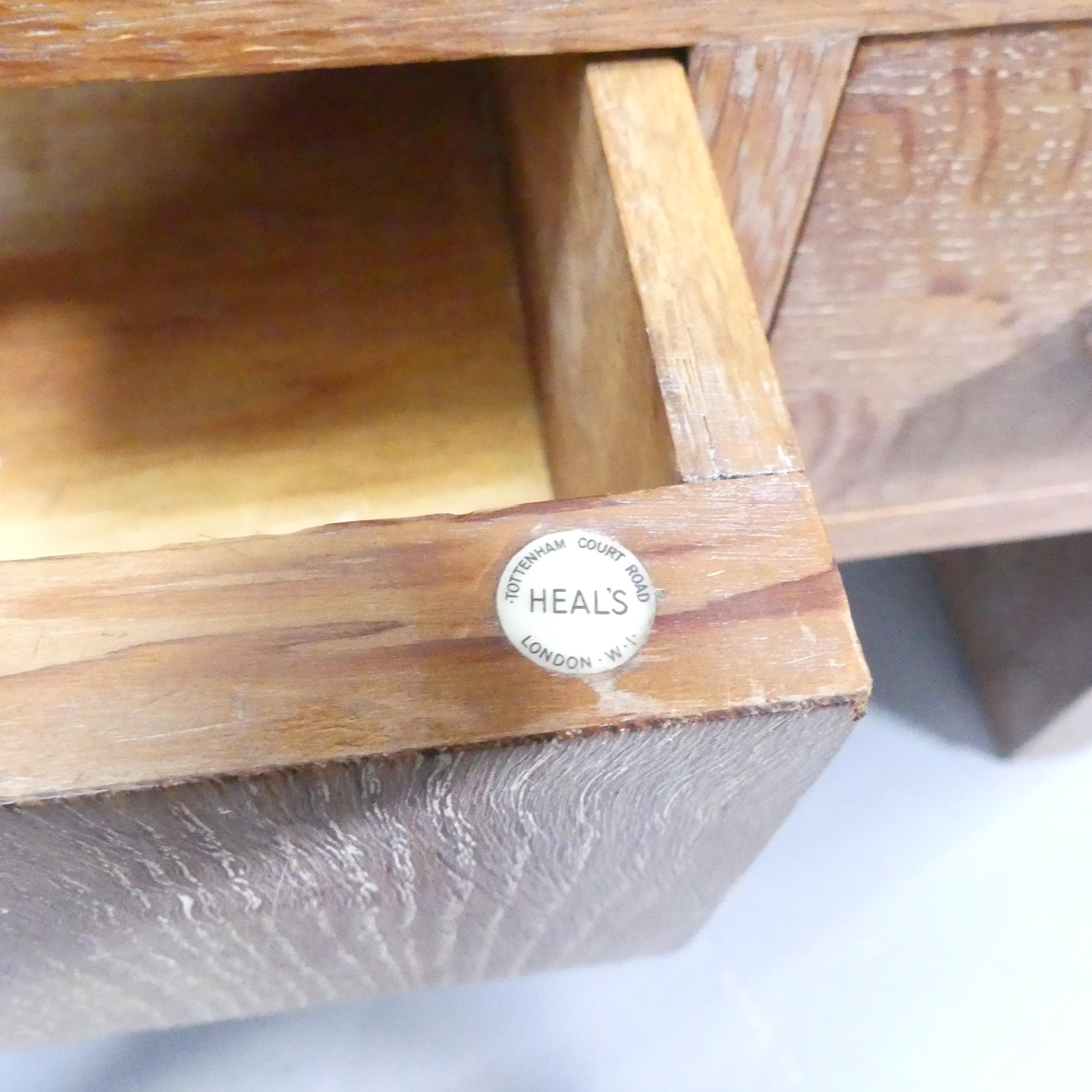 HEALS - A limed oak dressing table, with raised back, three drawers and maker's label. 107x154x49cm. - Image 3 of 3