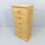 A narrow pine chest of six drawers. 46x92x32cm.