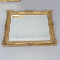 A gilt-wood and gesso framed rectangular wall mirror. 73x58cm. Frame is antique, but the glass is