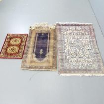 A cream-ground Persian rug, 110x70cm, a prayer mat and another mat. (3)