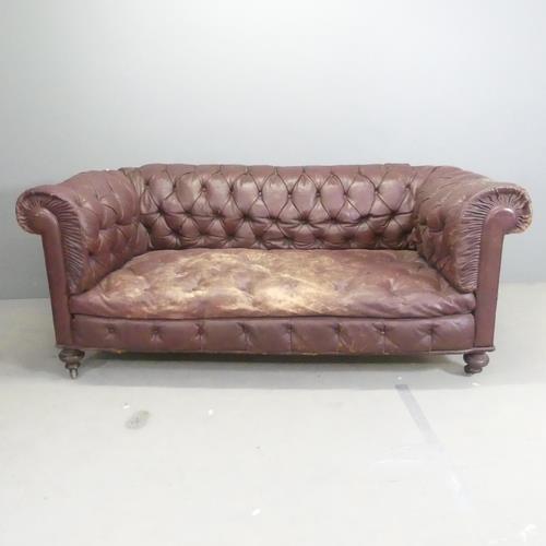 A Victorian buttonback studded leather upholstered Chesterfield style sofa. Overall 183x74x80cm,