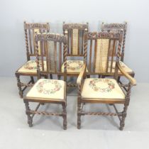 Five Jacobean style dining chairs, with barley twist supports, cane panelled backs and upholstered