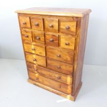 A modern hardwood chest of fourteen drawers. 80x110x35cm.