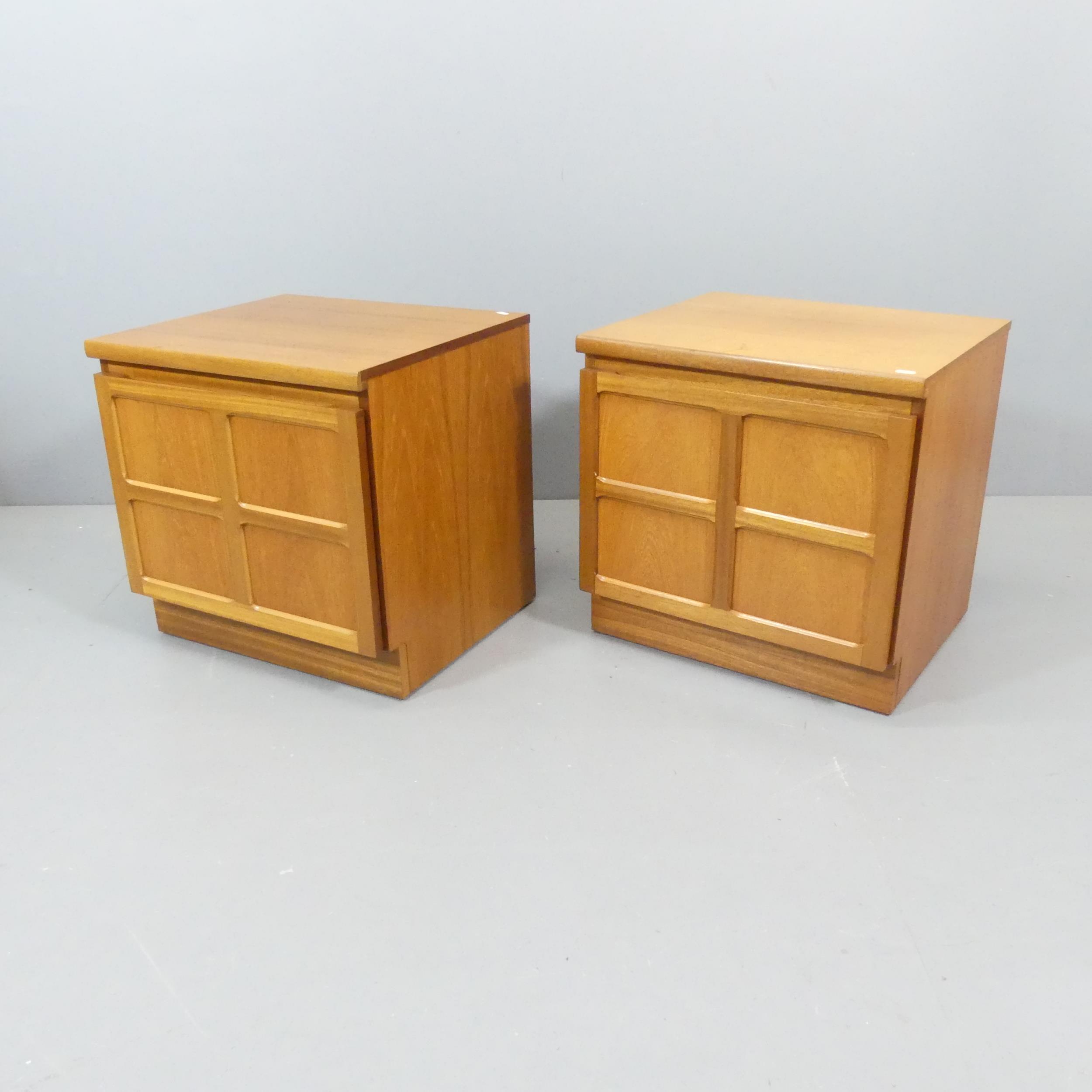 PARKER KNOLL - A pair of teak low or bedside cabinets, maker's mark to rear. 52x52x46cm.