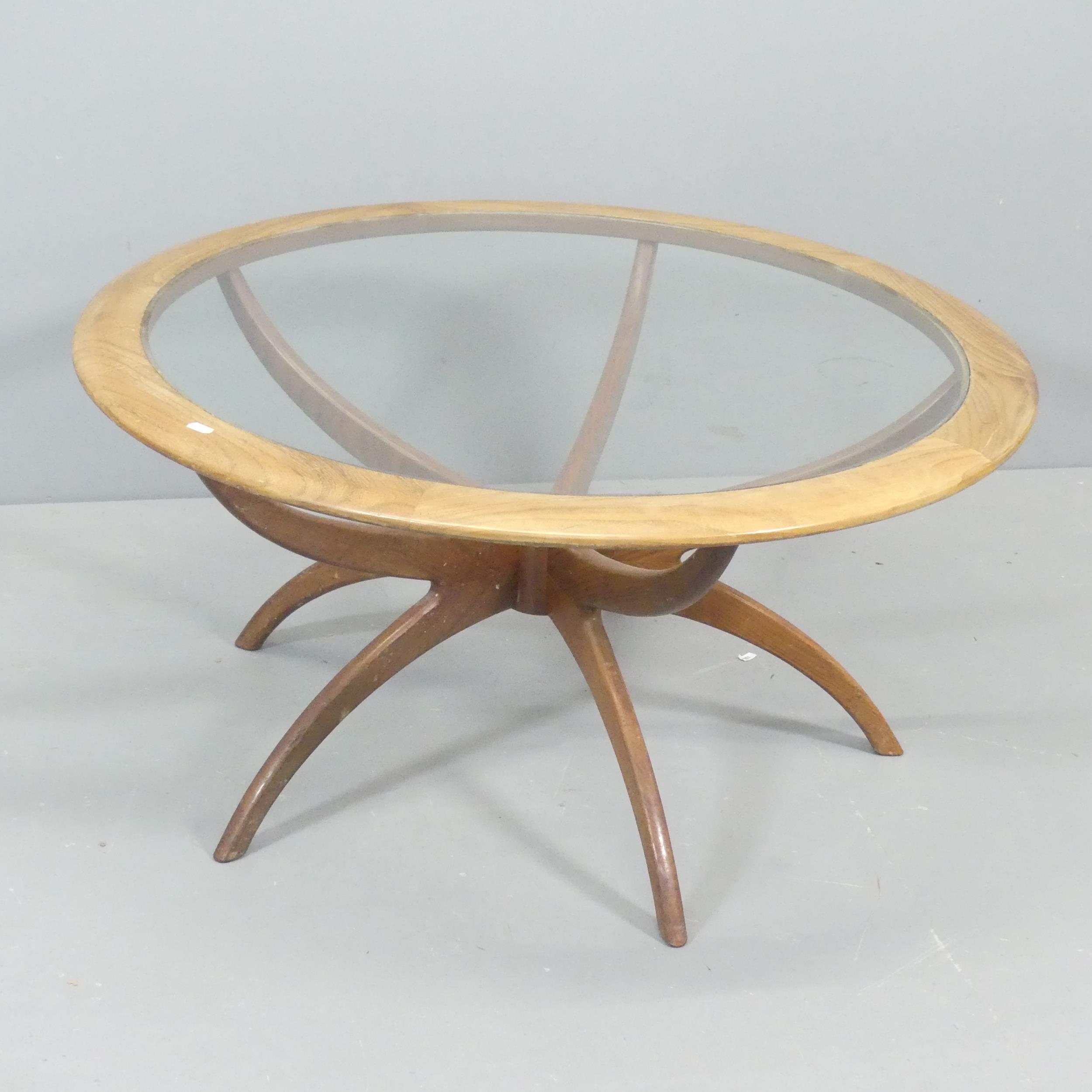 G-PLAN - A mid-century Astro Spider circular coffee table, with inset glass top and teak frame.
