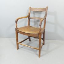 A Georgian elm-seated desk chair.