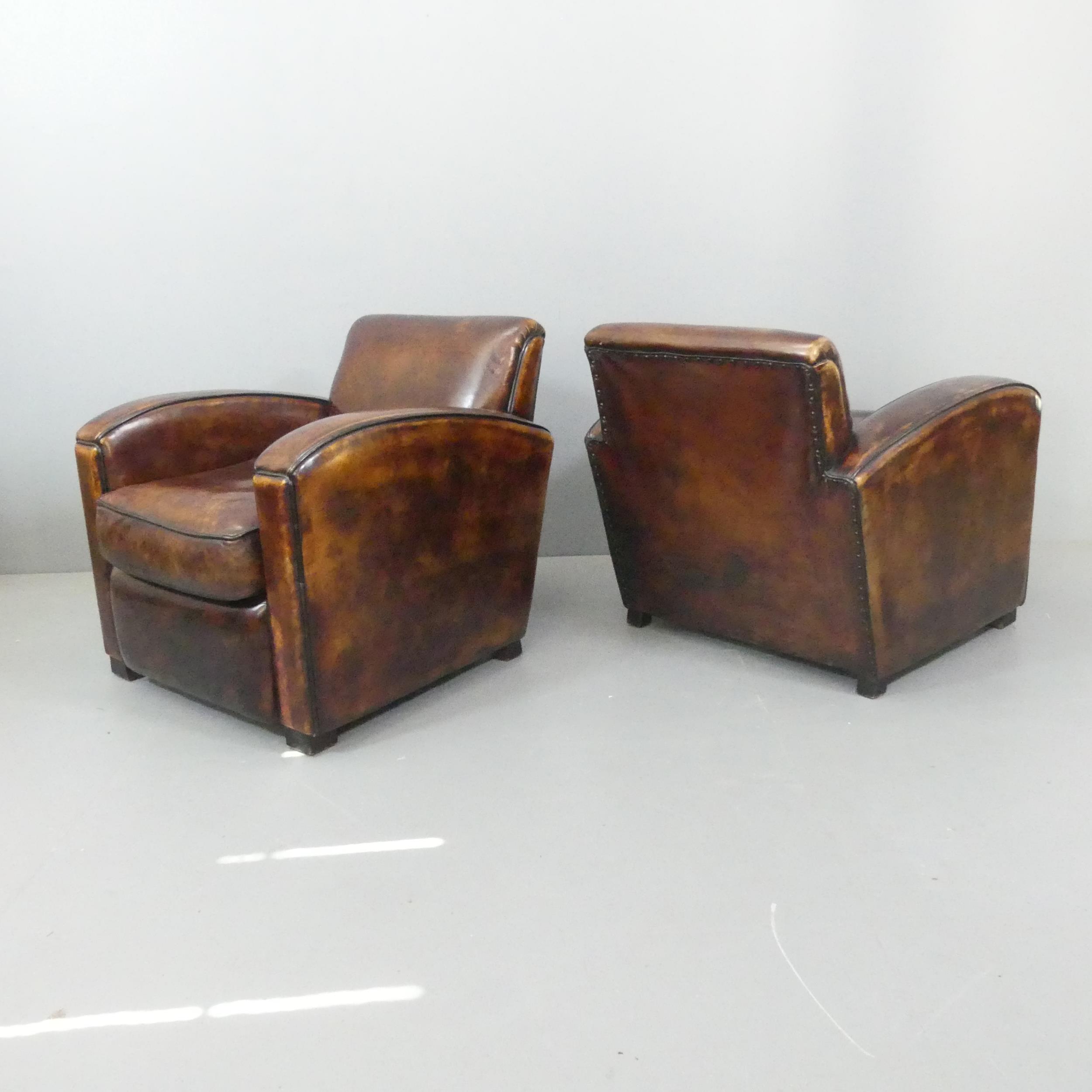 A pair of French Art Deco style leather club chairs in the manner of Jacques Adnet. Overall - Image 2 of 2