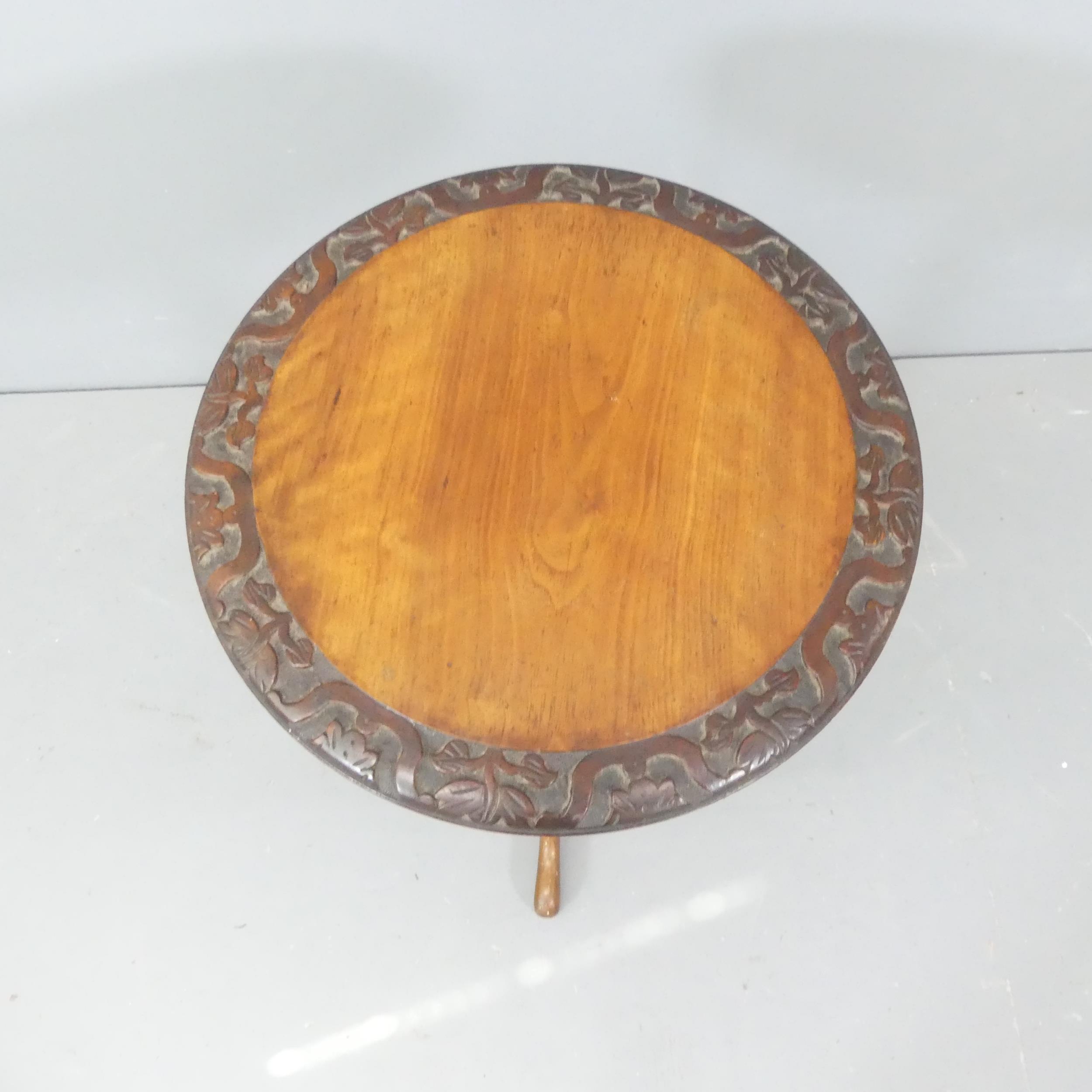 A Victorian mahogany and walnut circular topped occasional table, with carved decoration and - Image 2 of 2