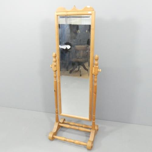 A Victorian style pine framed cheval mirror. 56x147cm.