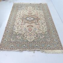 A handmade wool on cotton Kashan rug. 220x154cm.