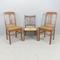 A pair of oak Arts & Crafts style cane-seated dining chairs, with carved and mother-of-pearl