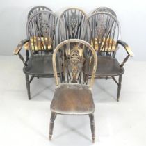 A set of six wheelback dining chairs. (4+2).