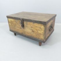 A stained pine and metal-bound tool chest. 67x36x42cm.