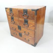 A small Japanese Tansu chest of four short and two long drawers, in single section. 61x60x38cm.