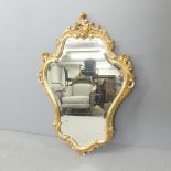 A modern Rococo style wall mirror. 59x82cm.