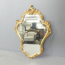 A modern Rococo style wall mirror. 59x82cm.