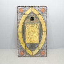 A large wrought-iron and yellow stained glass candle stand wall panel, with allover pierced scrolled