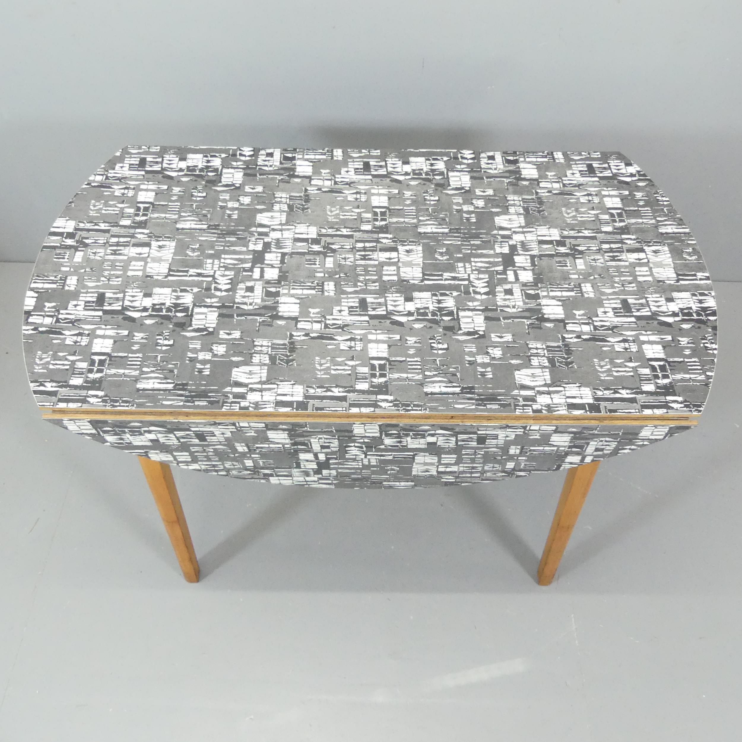 JACQUELINE GROAG - a mid-century Manhattan pattern Warerite formica topped drop leaf dining table, - Image 2 of 2