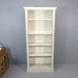 A modern painted pine open bookcase. 100x220x39cm.