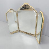 A modern three-fold gilt framed dressing table mirror. Dimensions (folded) 43x68cm.