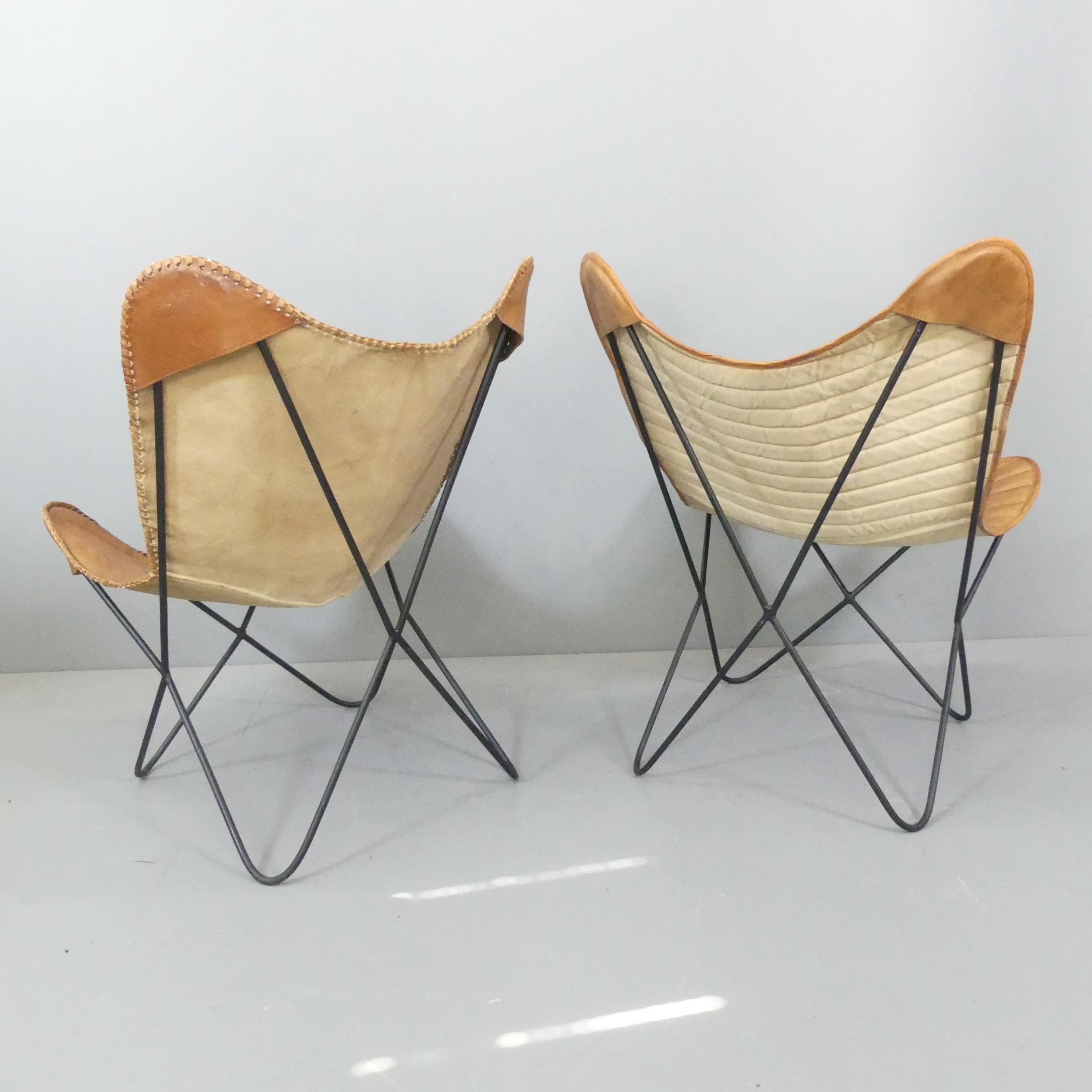 A pair of mid-century design butterfly chairs, with leather sling seats on tubular metal frames. - Image 2 of 2