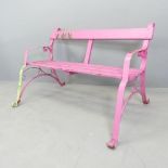 A pink painted Victorian iron strapwork bench. 130x74x78cm. Screw repair to rear of left leg.
