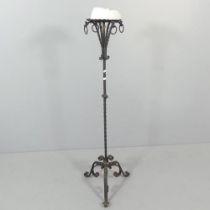 An antique wrought iron candle stick stand. H - 132cm.