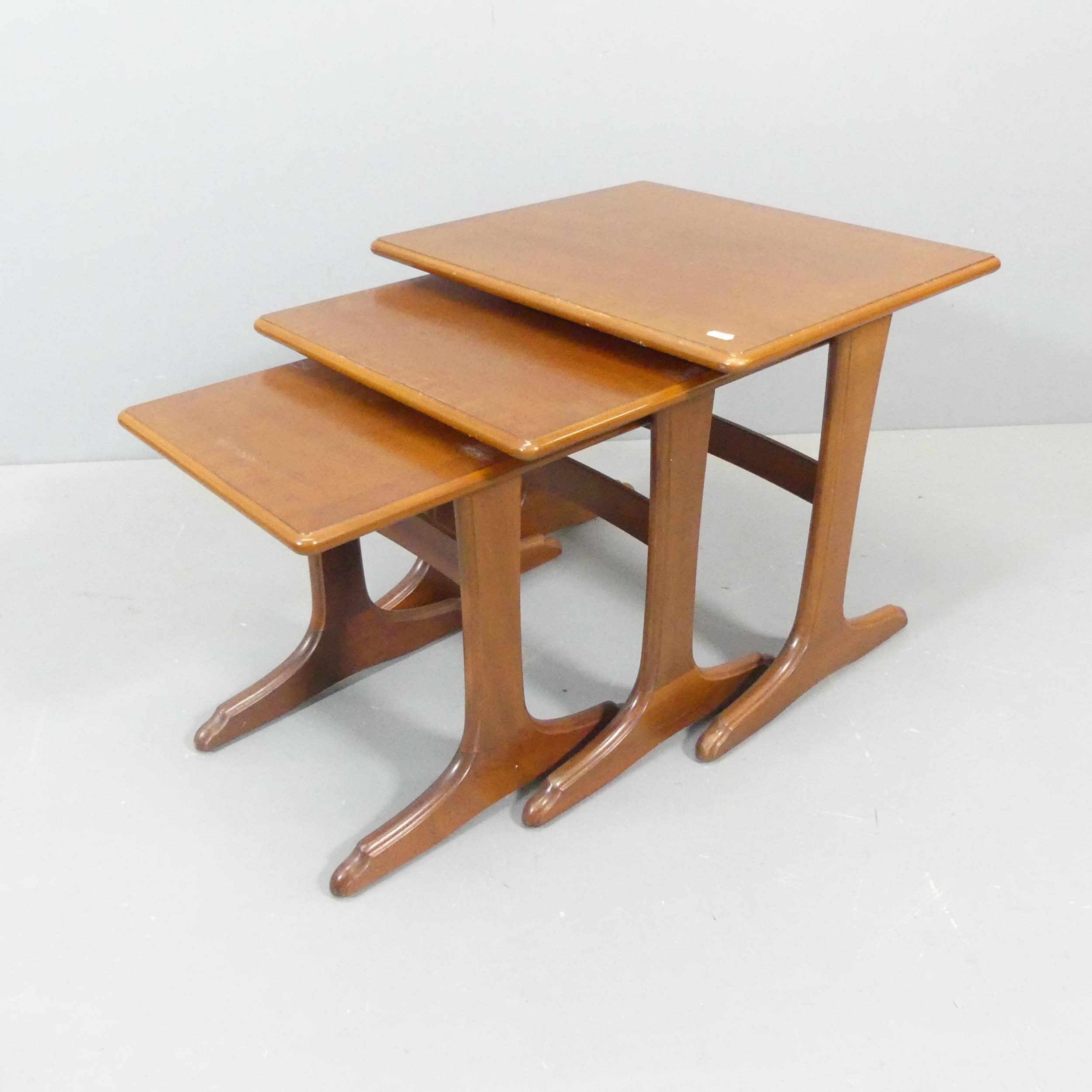 PARKER KNOLL - A teak next of 3 tables., with maker's labels. Largest - 56x49x48cm.