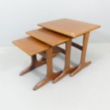 PARKER KNOLL - A teak next of 3 tables., with maker's labels. Largest - 56x49x48cm.