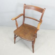 A 19th century elm-seated desk chair.