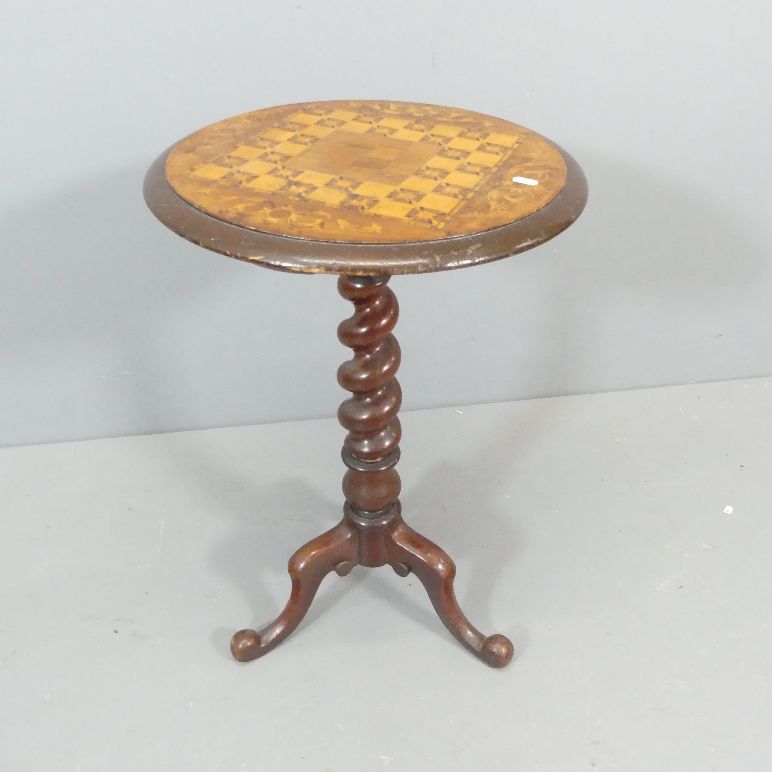 A 19th century mahogany and walnut veneered circular occasional table, with specimen inlaid games-