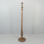 An early 20th century mahogany standard lamp, with four bulb fitting, carved decoration and pedestal