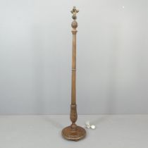 An early 20th century mahogany standard lamp, with four bulb fitting, carved decoration and pedestal