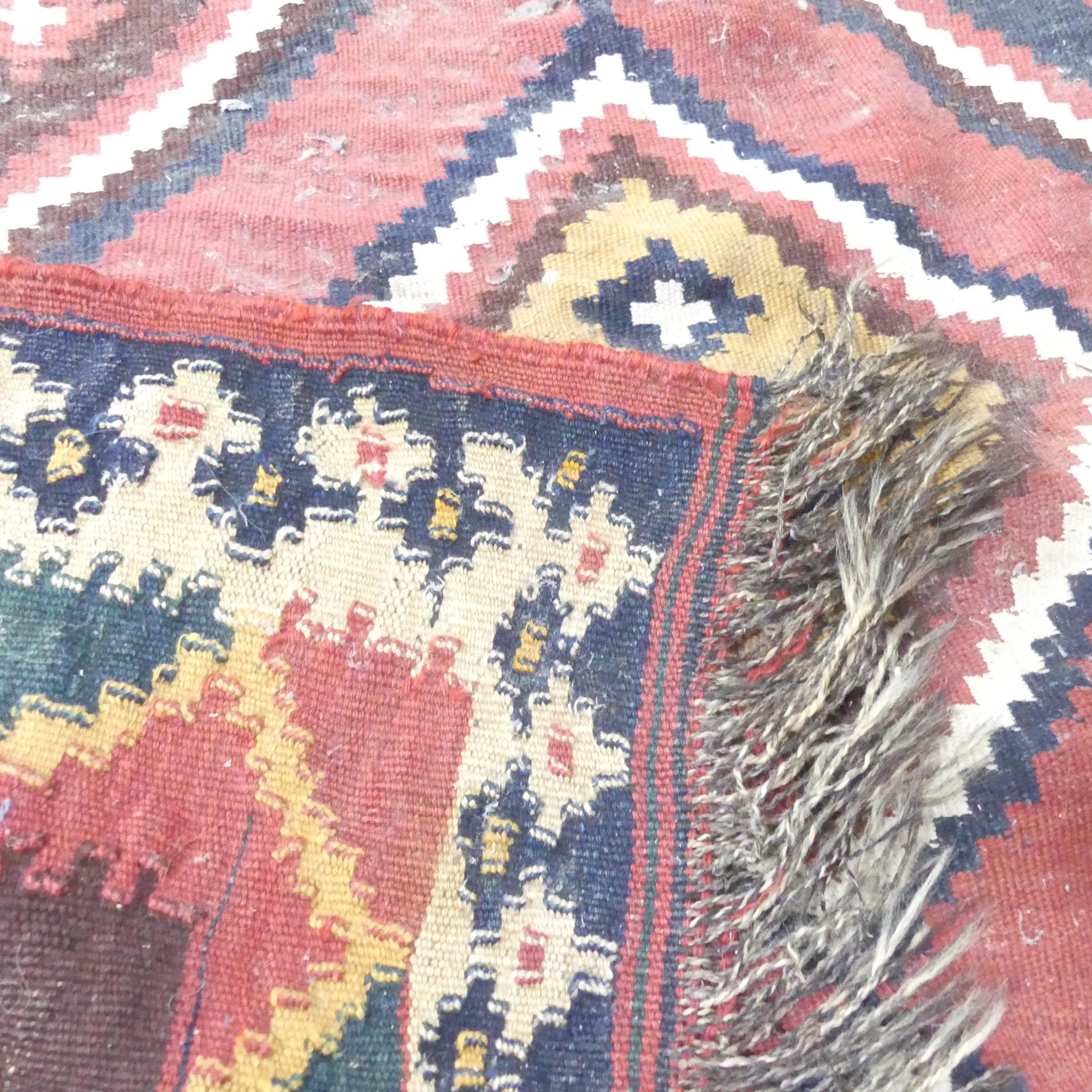 A red and cream-ground Kilim carpet. 270x126cm. Some signs of moth damage. Would benefit from a - Image 2 of 2